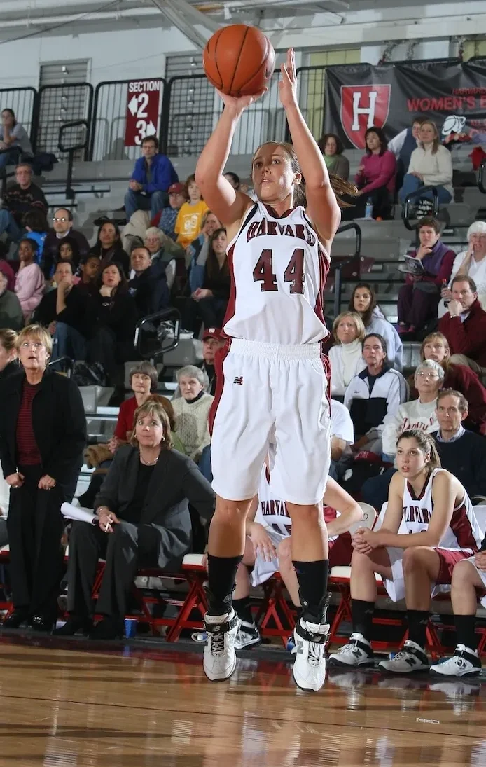 A woman is about to hit the basketball.